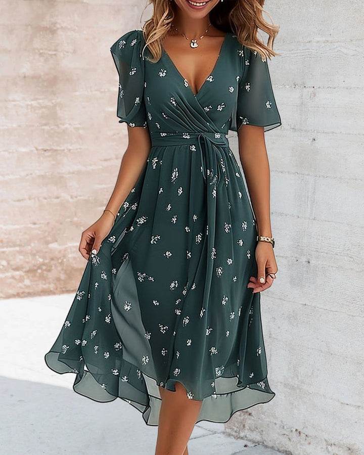 Robe élégante imprimée avec décolleté en V et nœud