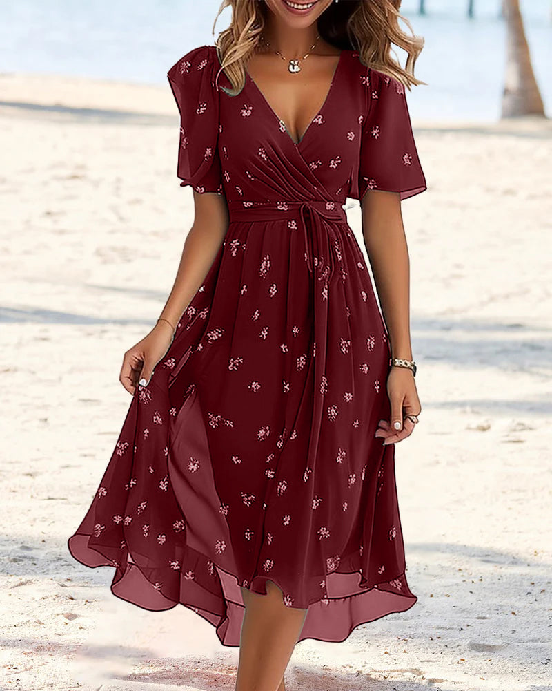 Robe élégante imprimée avec décolleté en V et nœud