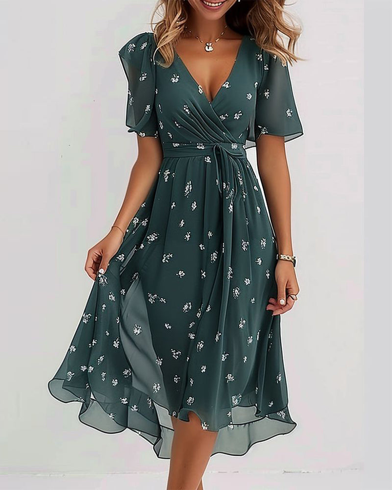 Robe élégante imprimée avec décolleté en V et nœud